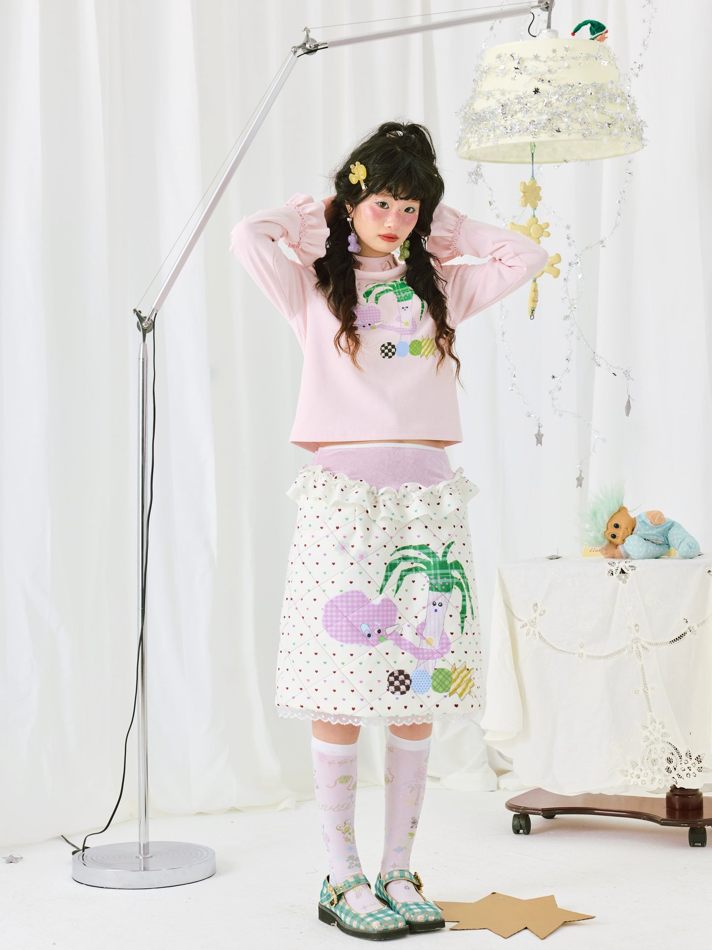 Harajuku-style HELPHELP diamond quilted stretch mesh patchwork two-tone skirt with colorful prints and a unique, edgy design.