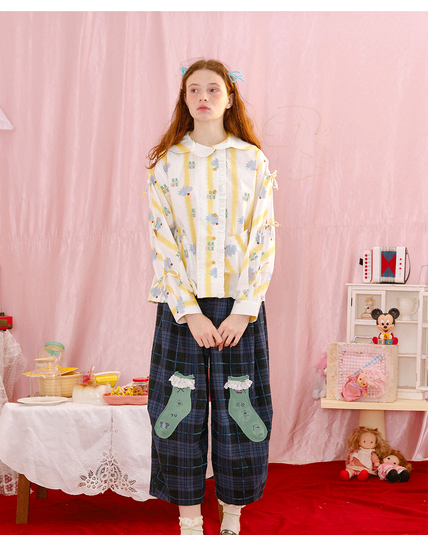 Harajuku-style HELPHELP yellow striped bow shirt with an irregular collar and unique illustration print.