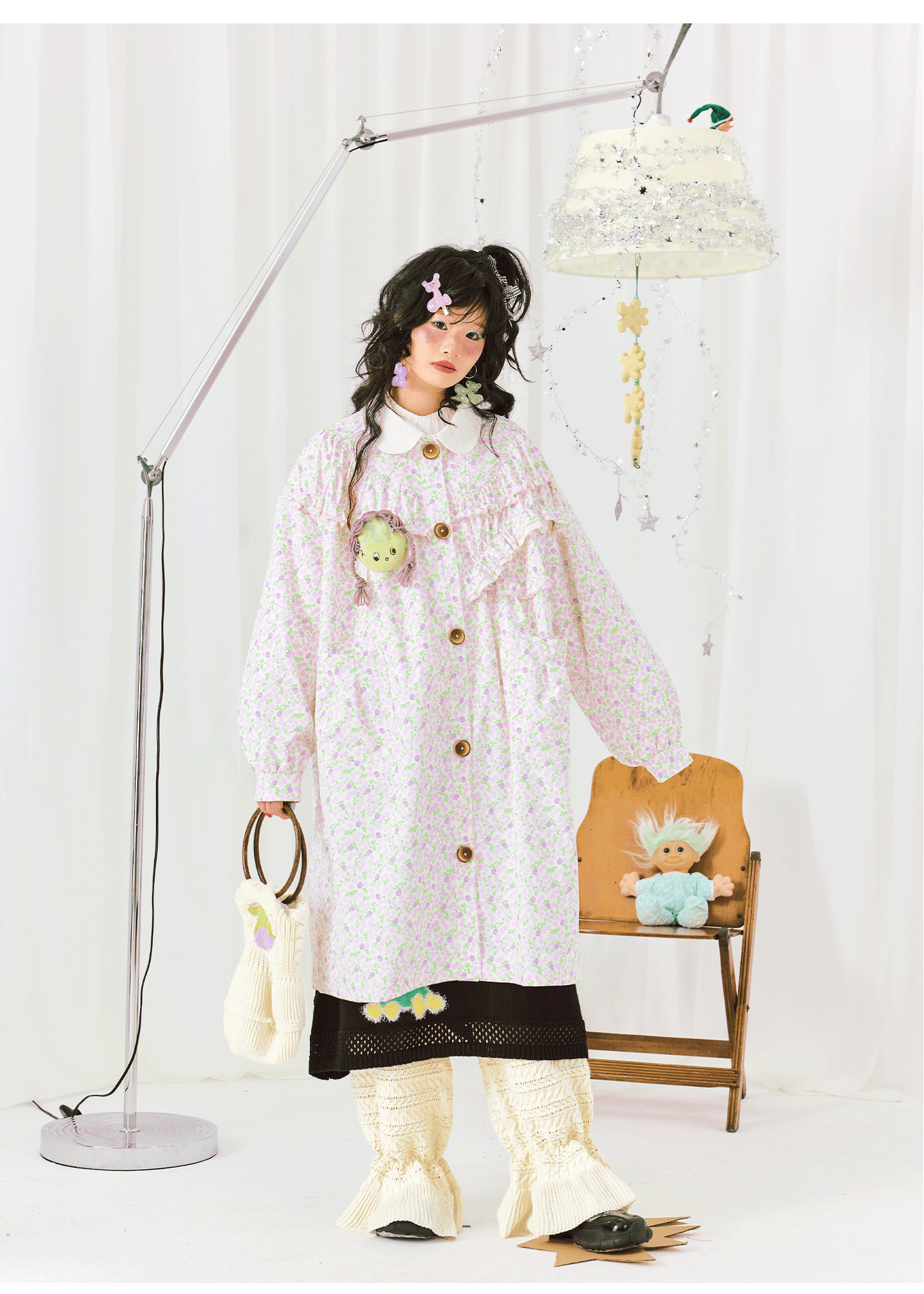 Harajuku-style HELPHELP trench coat with a small floral print, Peter Pan collar, and long sleeves for a vintage-inspired look.