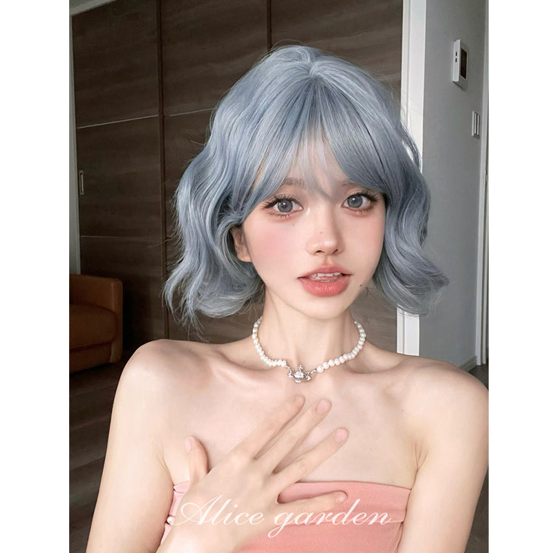 Alice Garden Harajuku style bobo wig featuring short curls in a unique gray, purple, and blue gradient with bangs for a stylish and playful look.