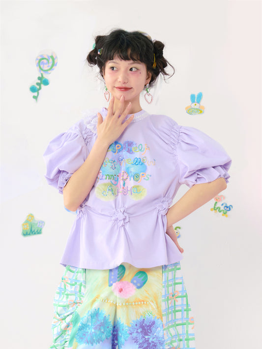 HelpHelp Harajuku style purple t-shirt featuring colorful graffiti print, lace trim, and puff sleeves for a cute and artistic look.







