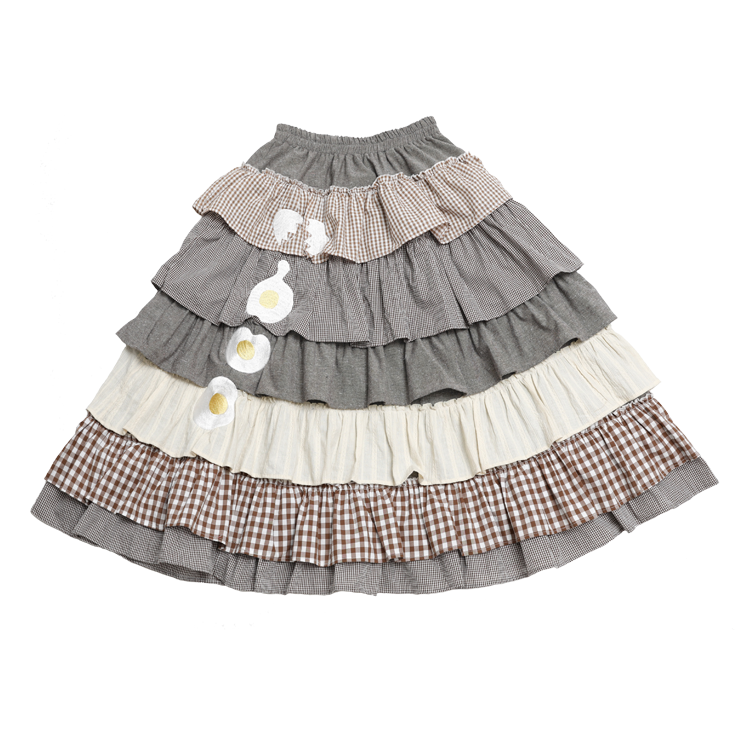 Detailed shot of the lace and bow accents on the Meugler brown plaid Harajuku Sweet Lolita cake skirt.