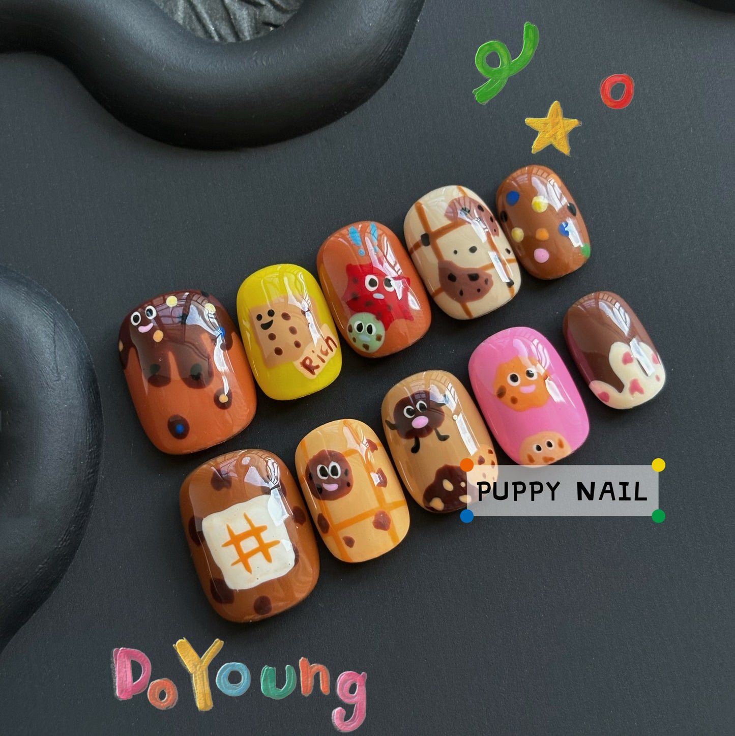 Harajuku-style Puppy Chocolate Cookie hand-painted wearable nail art, featuring cute cartoon-inspired cookie designs on colorful nails, perfect for a sweet and fun look.