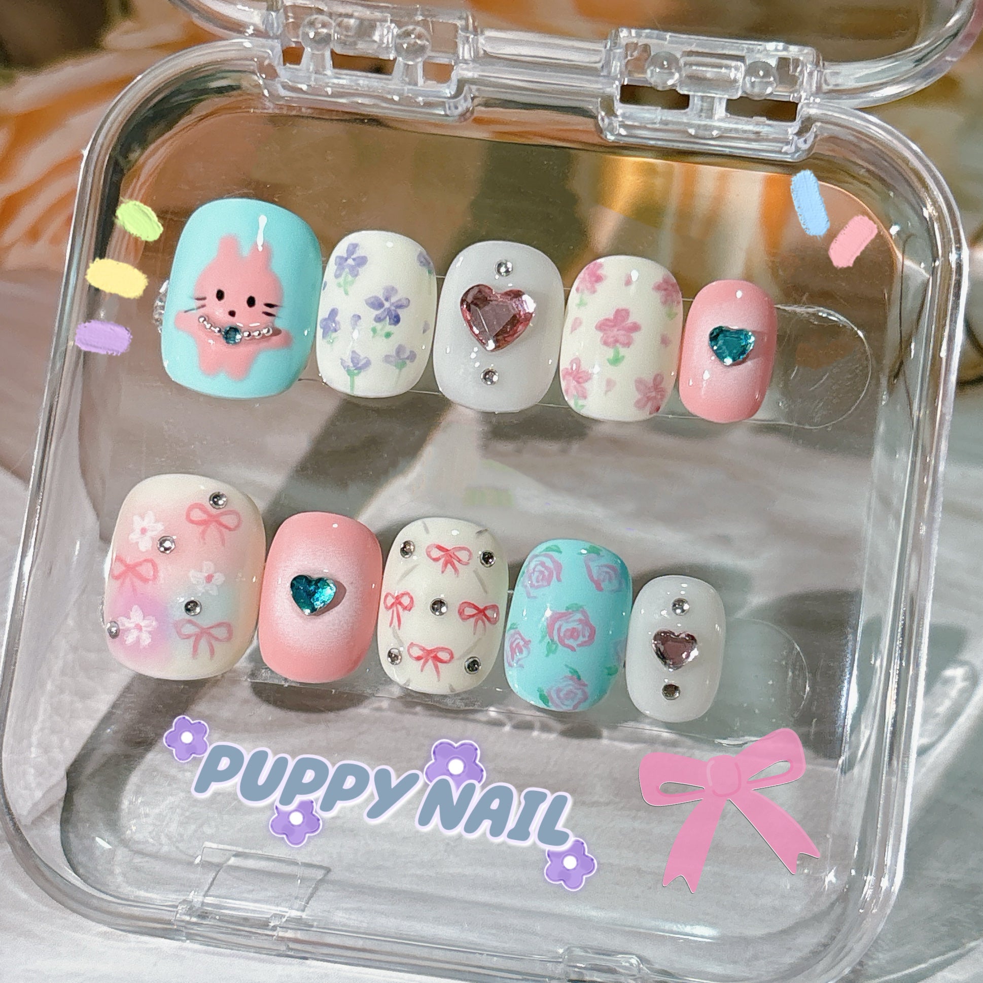 Harajuku-style Puppy floral hand-painted bow nails with cute bunny and bow designs, featuring a summer floral theme for a playful, pastel-colored look.







