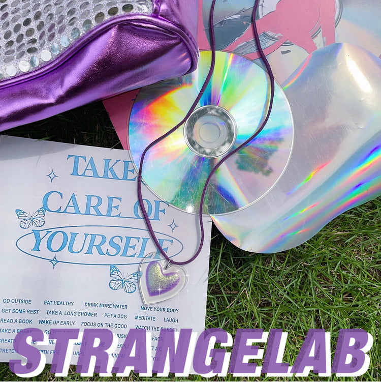 Strangelab Decora-style purple glitter acrylic heart choker with Y2K-inspired suede rope binding, a vibrant and playful accessory perfect for adding a fun, colorful touch to your outfit.